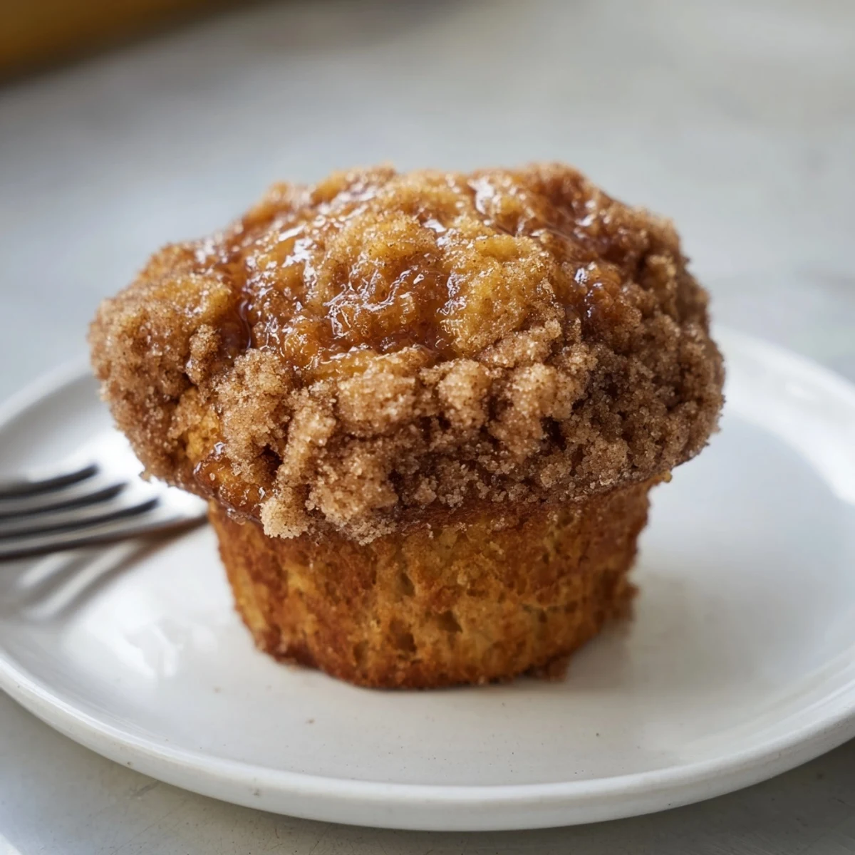 Golden muffins filled with sweet potato, bourbon, and a crunchy cinnamon sugar crust.  