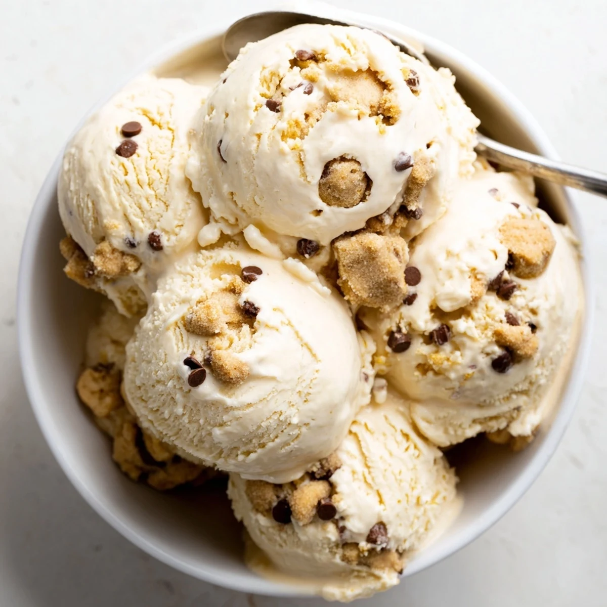 Creamy cottage cheese ice cream swirled with chocolate chip cookie dough bites.  