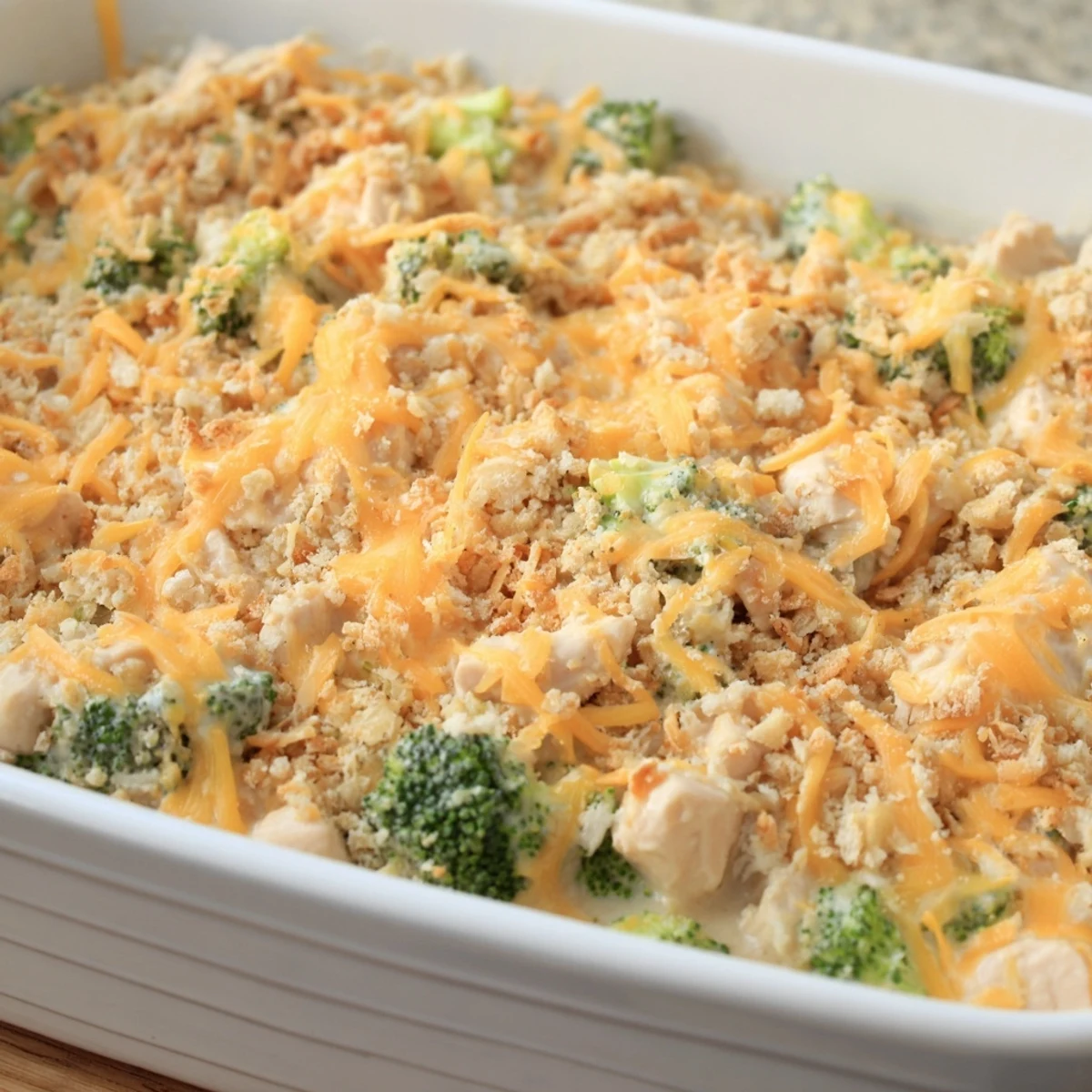 Golden, bubbly Chicken & Broccoli Cheddar Bake, perfect for a cozy family dinner tonight.