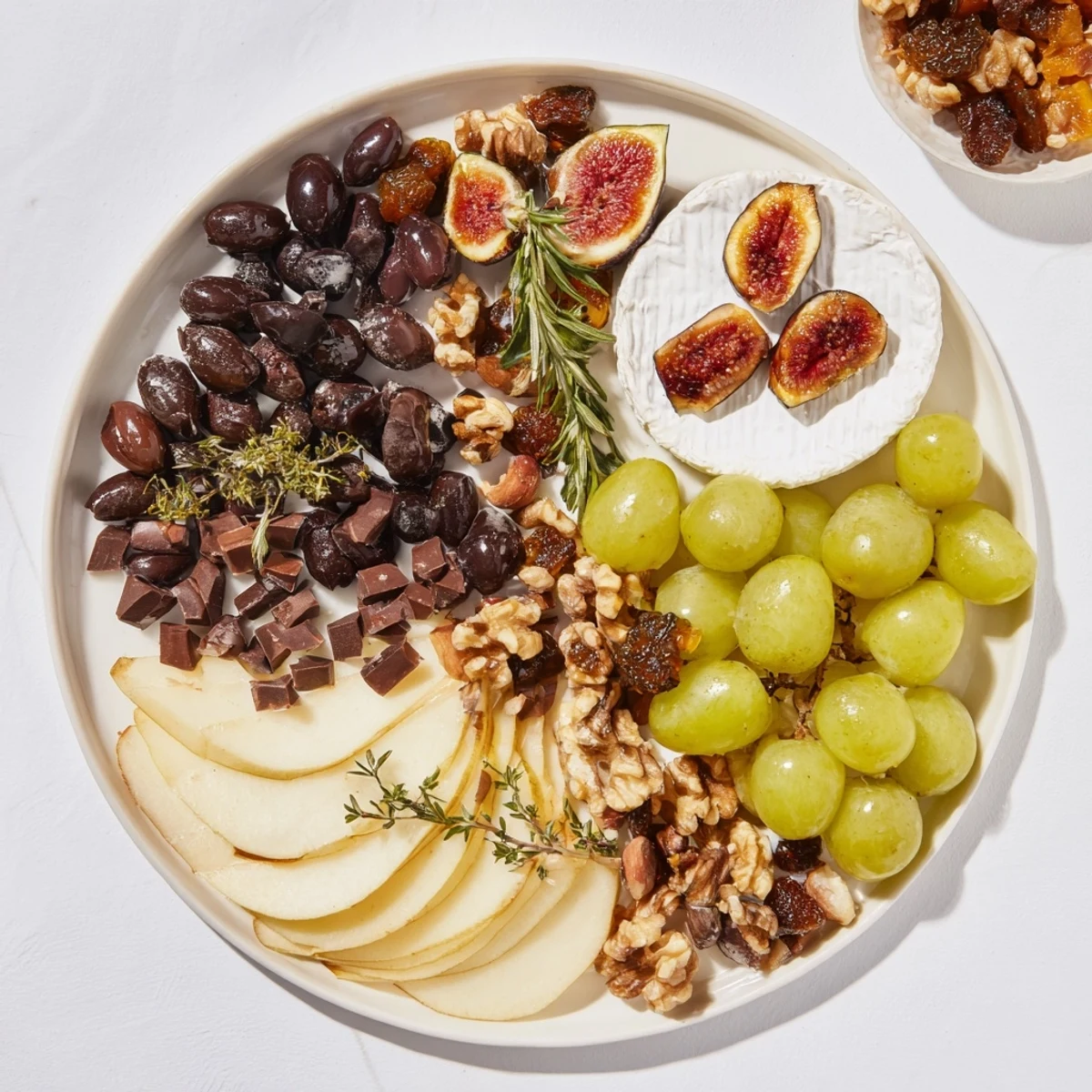This delightful Winter Solstice Board appetizes with creamy Brie, figs, and tasty nuts for serving.