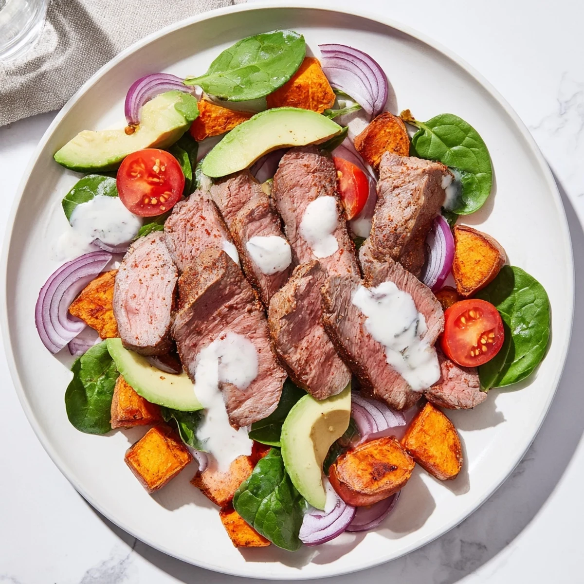 Steaming, vibrant Beef Avocado Sweet Potato Bowl with tender beef and creamy avocado, ready to eat.