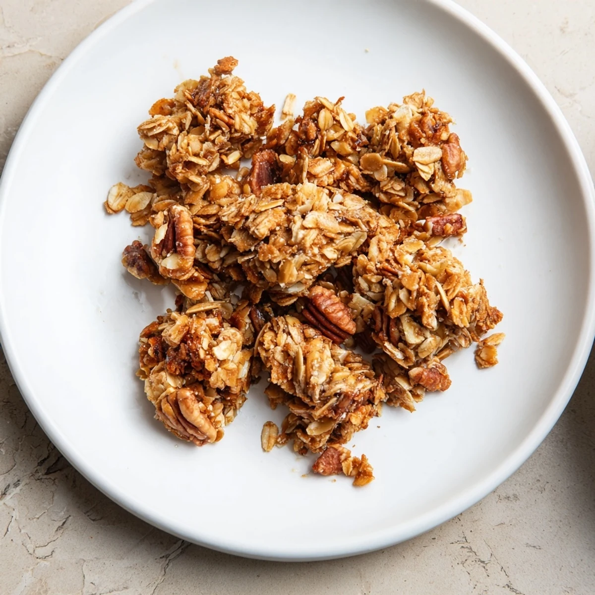 Enjoy the sweet, crunchy texture of these homemade Honey Nut Granola Clusters served with cold milk.