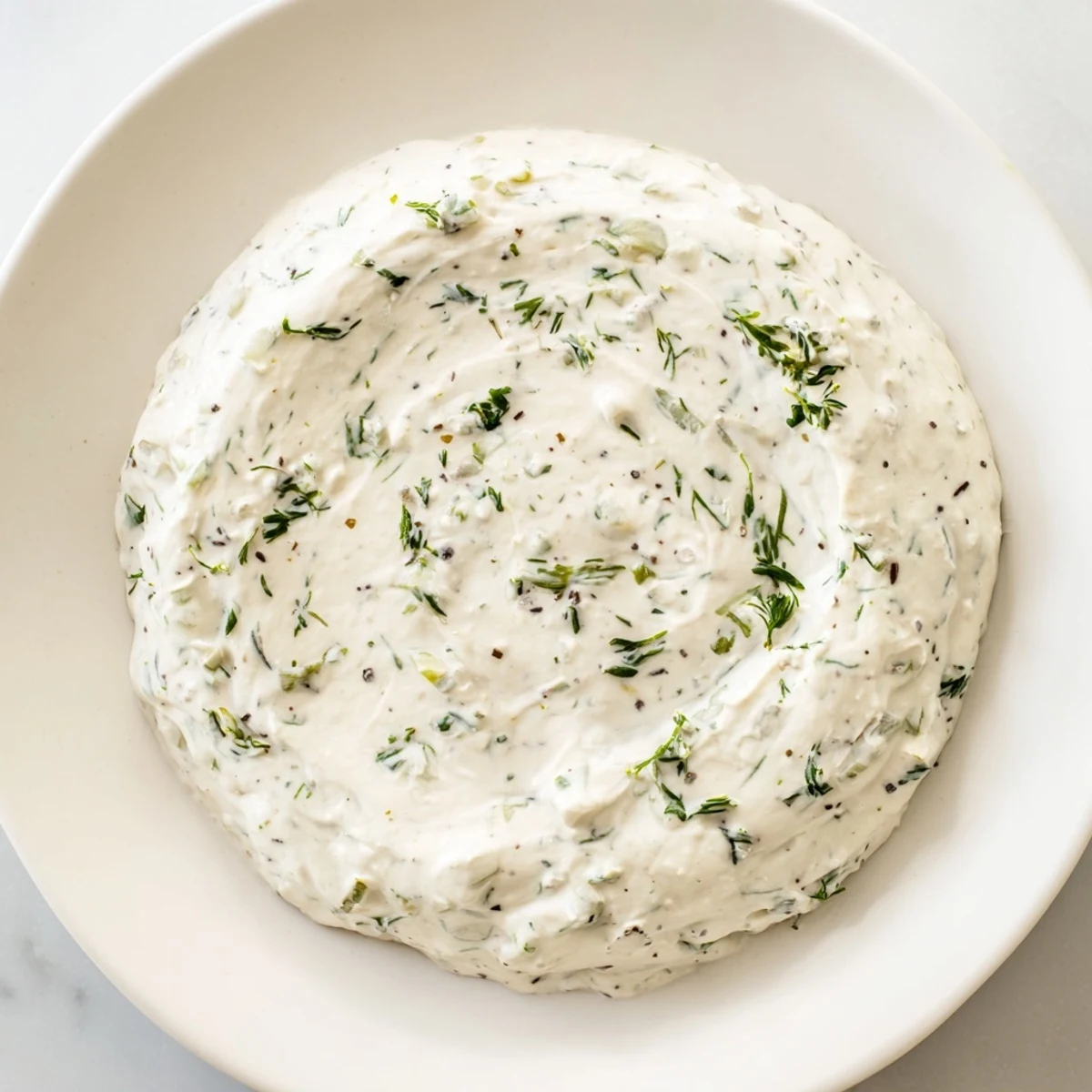 Homemade Greek Yogurt Ranch Dip, a healthy and light appetizer, served with a selection of tasty chips.