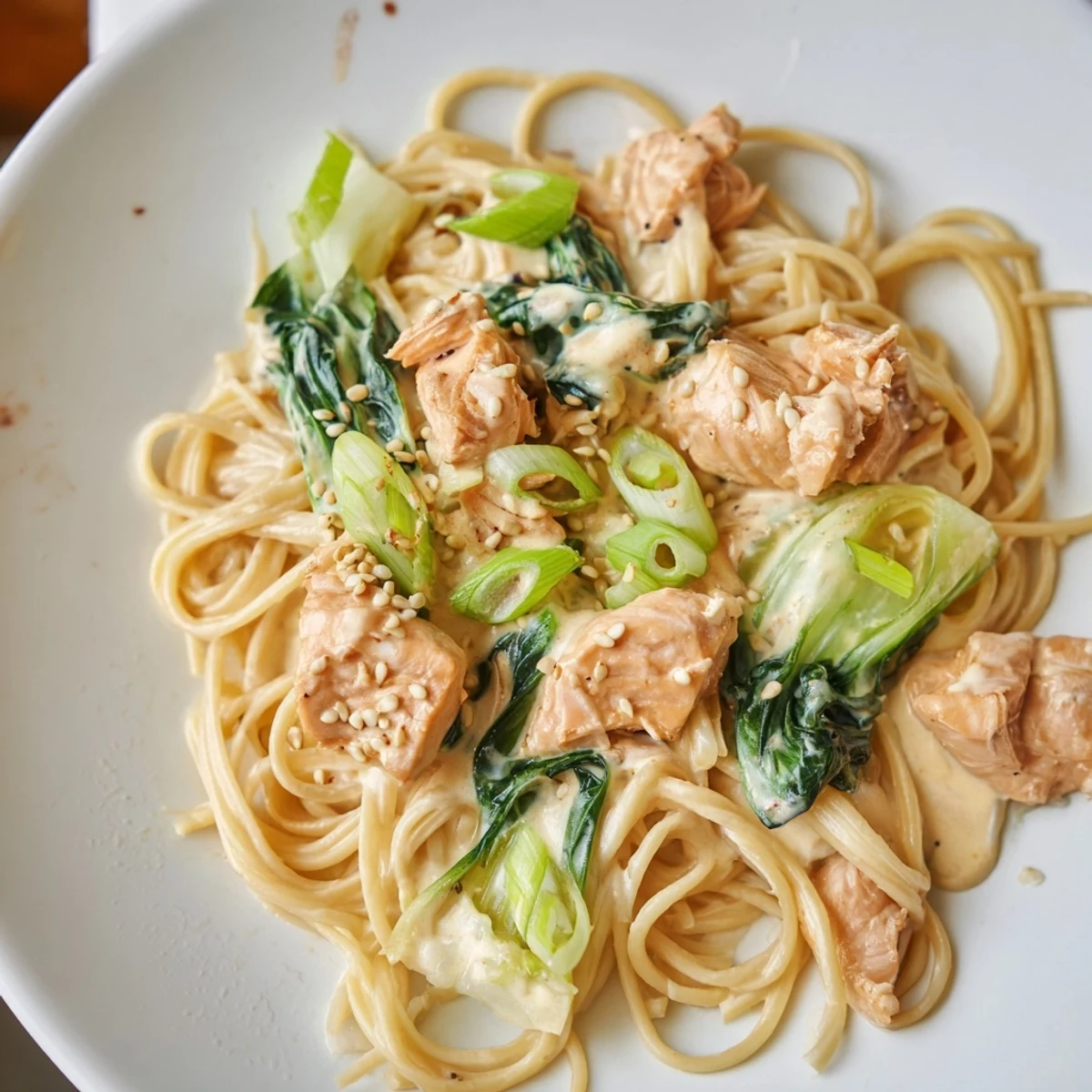 Tender salmon and noodles swimming in umami flavor, this Miso Butter Salmon Pasta is irresistible.