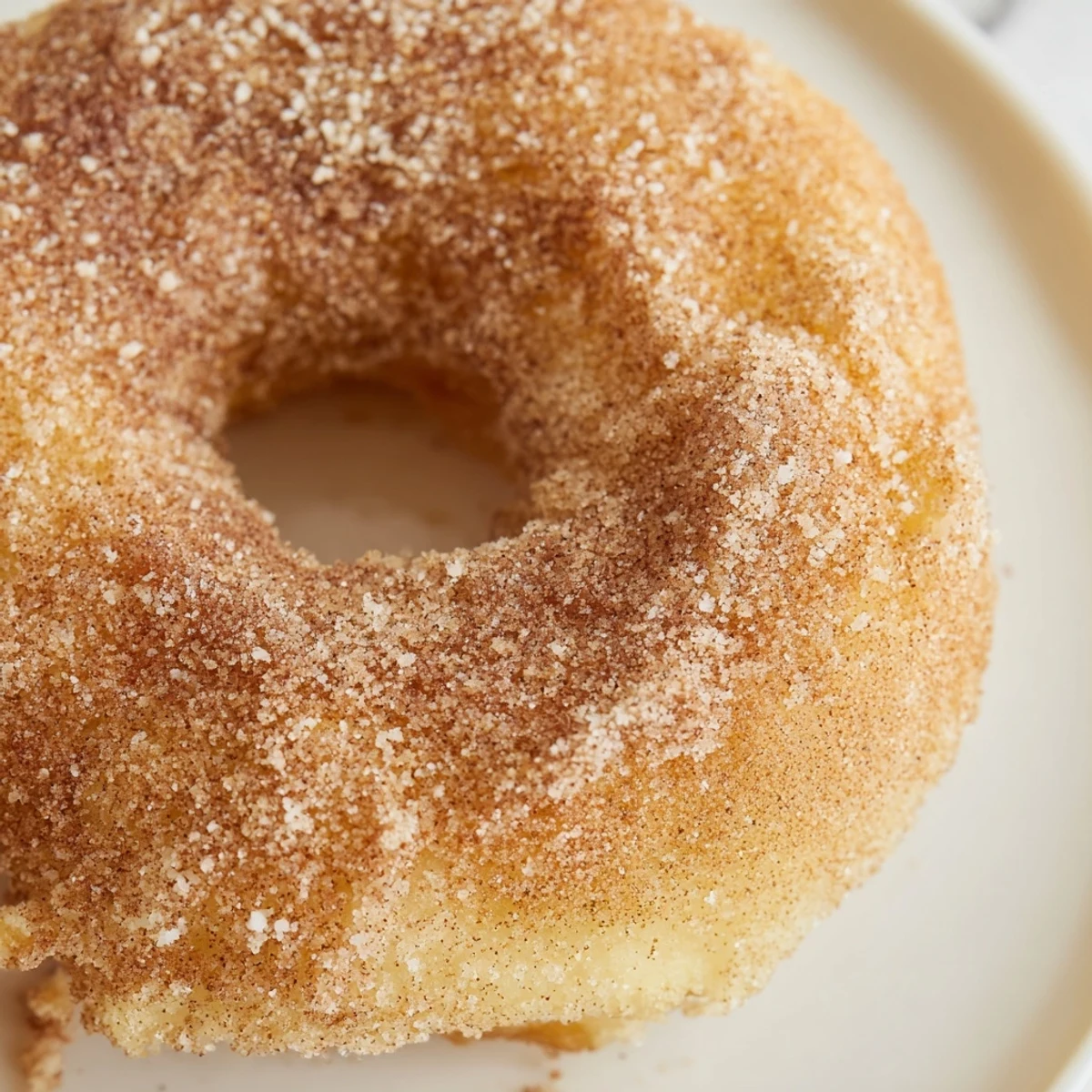 Close-up of fluffy air fryer cinnamon sugar donuts, perfect American dessert ready for a tasty bite.
