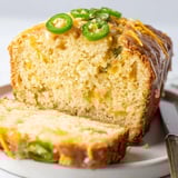 Enjoy a slice of Maple Ginger Cheesy Jalapeño Biscuit Muffin Loaf, rich and spicy.  