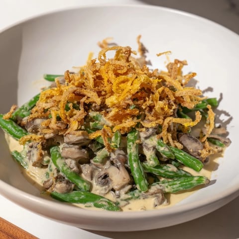 Golden, bubbly Old-School Green Bean Casserole with a creamy mushroom sauce and crispy onions.