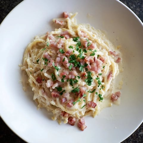 Instant Pot Carbonara Ramen: A steaming bowl of creamy ramen with crispy bacon and Parmesan.