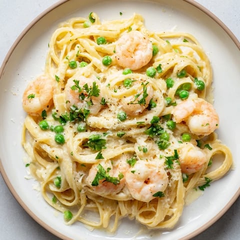 Instant Pot Shrimp Alfredo Pasta, creamy and savory, garnished with fresh parsley, ready to eat.