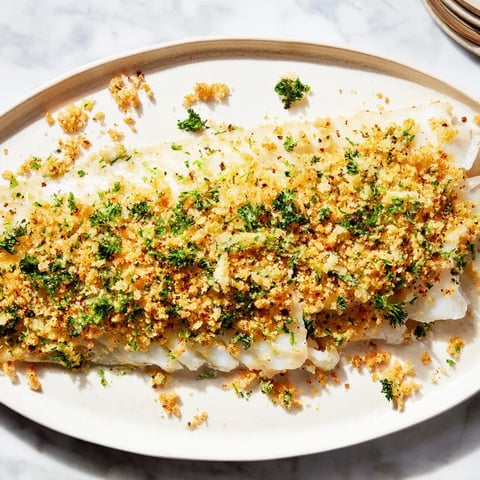 Golden, crispy Ritz cracker topping blankets flaky baked cod in this comforting, easy recipe.