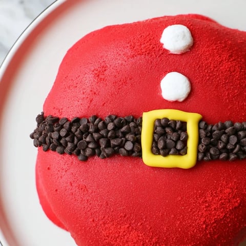 Festive Santa Belly Donuts, glazed red and chocolate adorned, ready for a delicious holiday treat.