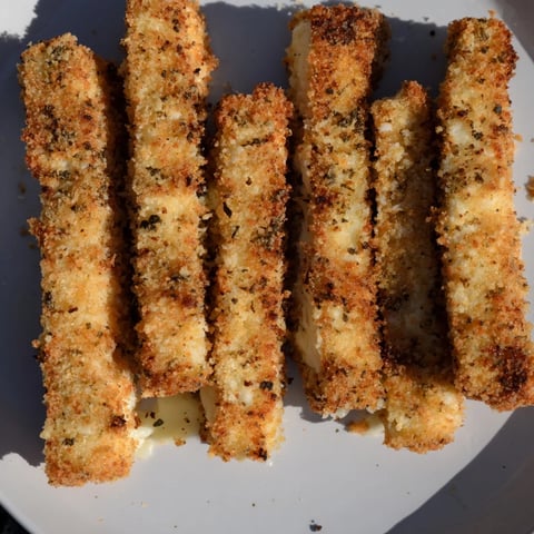 Golden, air fryer mozzarella stick grilled cheese fingers, oozing cheese, perfect for a quick and cheesy snack.