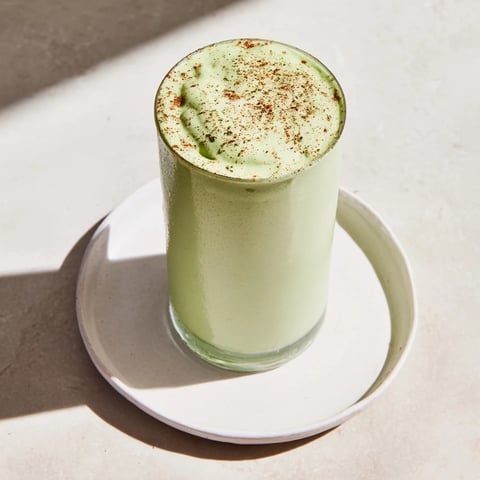 A creamy Matcha Snickerdoodle Protein Shake, a quick breakfast swirled with green and brown hues.