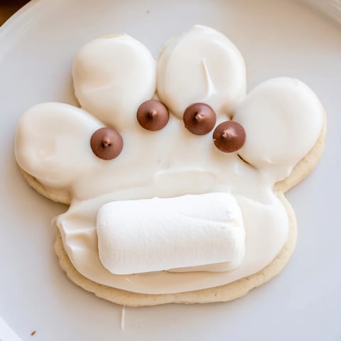 Warm, freshly baked Polar Bear Paw Print Cookies with cute marshmallow paw pads and chocolate toes.