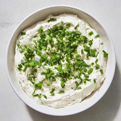 Creamy Veggie Ranch Dip with a vibrant chive garnish, perfect for fresh vegetable dippers.