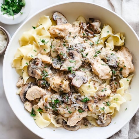 Warm, comforting Creamy Mushroom Chicken Pasta with tender chicken, mushrooms, and creamy sauce, perfect for dinner.