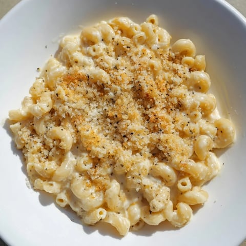 Golden, bubbly baked mac and cheese, a comforting American classic with melted cheese.