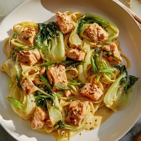 Creamy Miso Butter Salmon Pasta with perfectly cooked salmon and vibrant green bok choy.