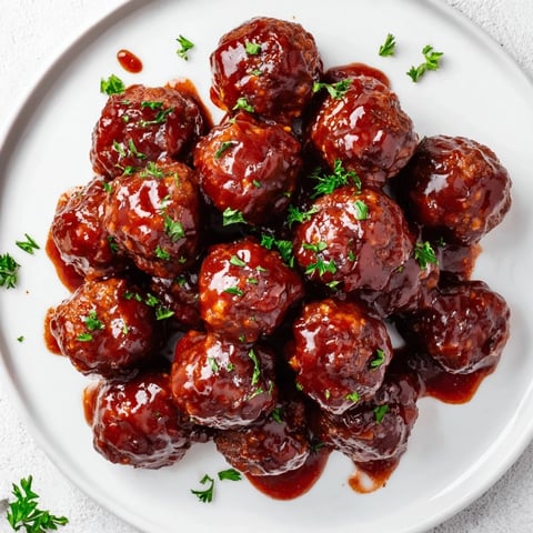 A slow cooker full of glistening cherry BBQ meatballs, perfect for an easy party appetizer.