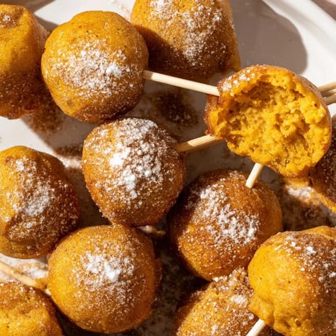 Delicious bite-sized pancake pops featuring rich pumpkin flavor and cinnamon aroma.  
