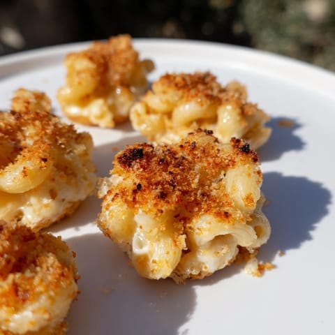 The cheesy interior of Ditalini Mac and Cheese Bites oozes, a perfect savory snack for parties.