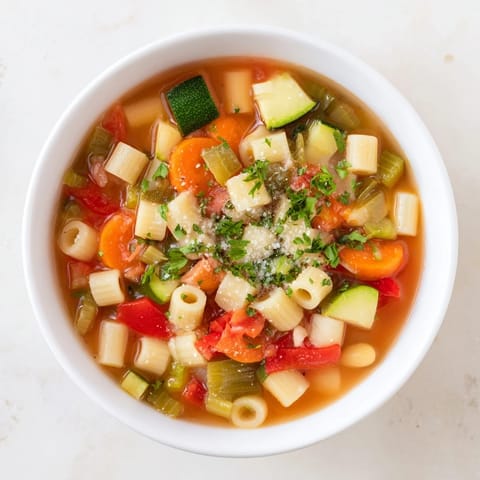 Lemony parsley garnish atop a rich, hearty Veggie-Packed Minestrone Christmas Pasta Pot.
