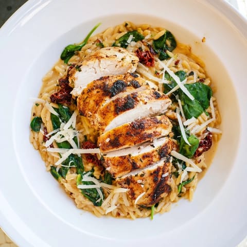 A one-pot creation: creamy Marry Me Chicken Orzo, filled with sun-dried tomatoes and tender chicken.