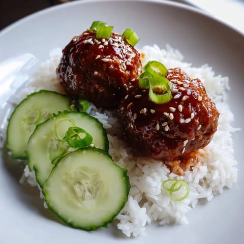 A close-up of delicious teriyaki meatball bowls with tender rice, perfect for a filling, flavorful dinner.