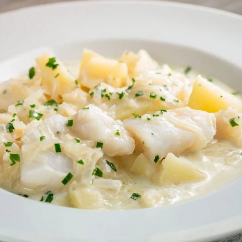 Freshly made Icelandic fish stew, garnished with herbs, ready to be served on a cold evening.