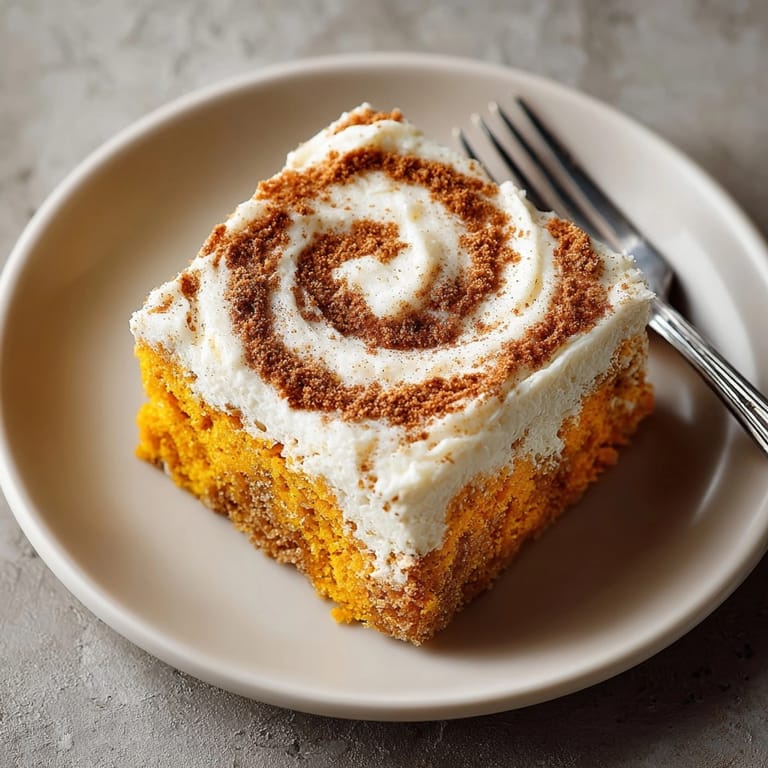 The finished Chaos Cake sheet cake shows off a beautiful cinnamon swirl topping, ready to serve.