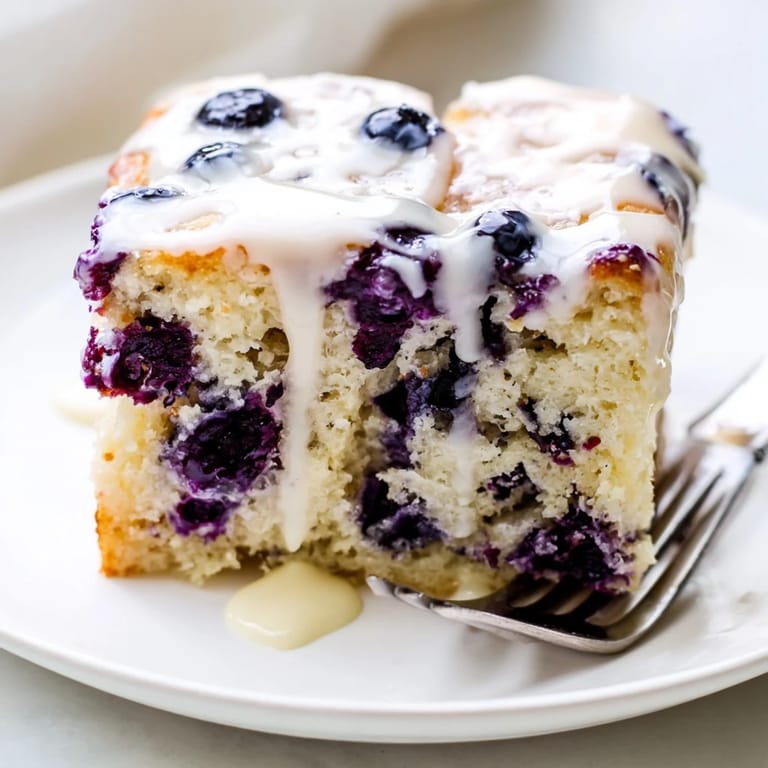 Deliciously light blueberry pancake soda sheet cake, bursting with fresh fruit flavor.