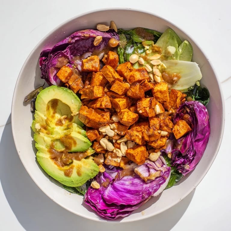 A colorful, gluten-free Spiced Peanut Sweet Potato & Radicchio Salad Bowl, perfect for a healthy lunch.