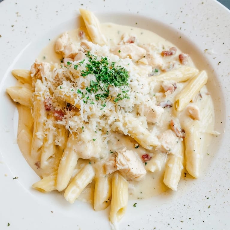 Savory Tinis Creamy Chicken Pasta—a flavorful Italian-American comfort food, ready to serve and enjoy.