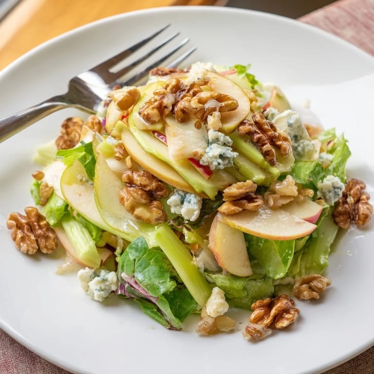 A vibrant Apple and Walnut Salad with toasted walnuts, crisp apples, and a drizzled tangy dressing for a quick, healthy side.